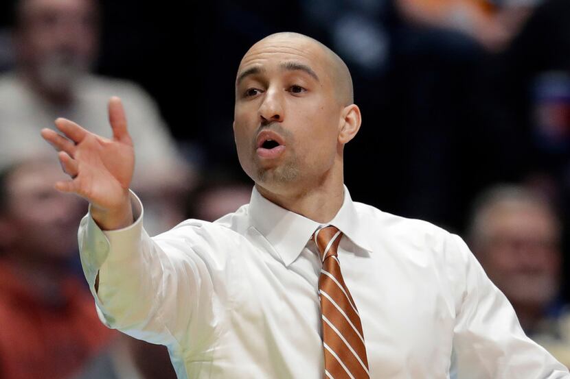 Texas head coach Shaka Smart calls out from the bench in the second half of a first-round...