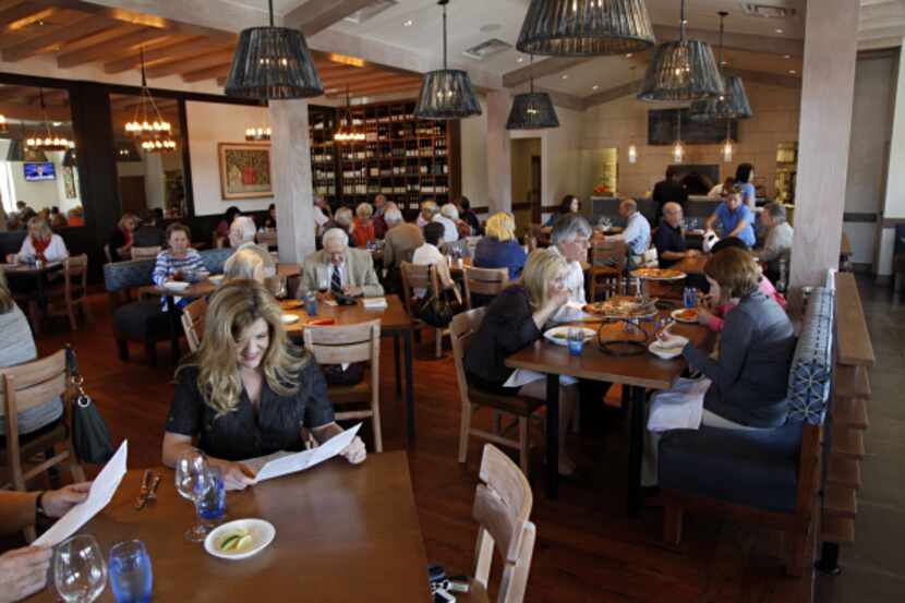 Princi Italia located in North Dallas, has a couple of rectangular tables for six in the...
