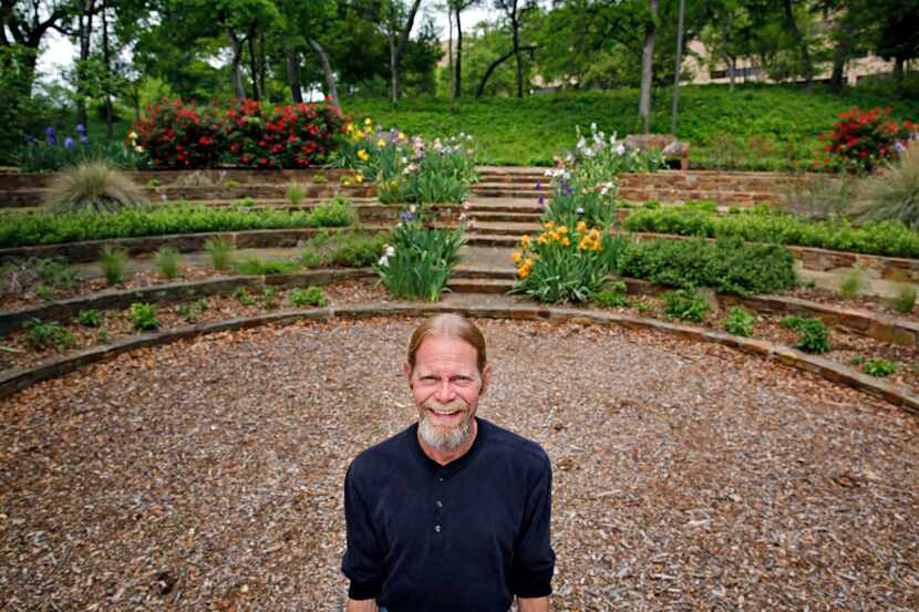 Steve Houser, a long-time volunteer at Reverchon Park, helped restore the iris bowl at the...