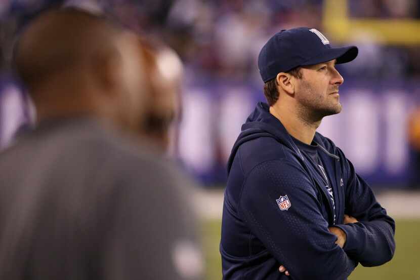 Dallas Cowboys quarterback Tony Romo along the sideline during a National Football League...