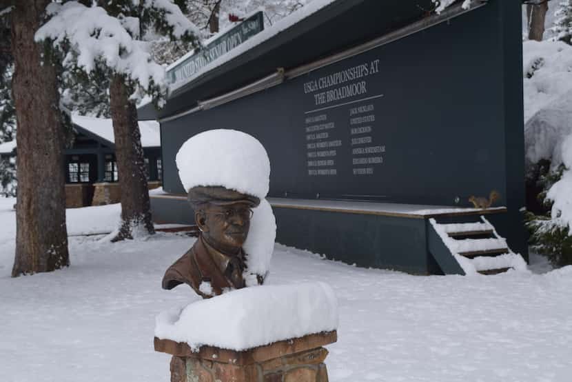 "No golf today." Snow-capped statue of golf architect Donald Ross, who designed first...