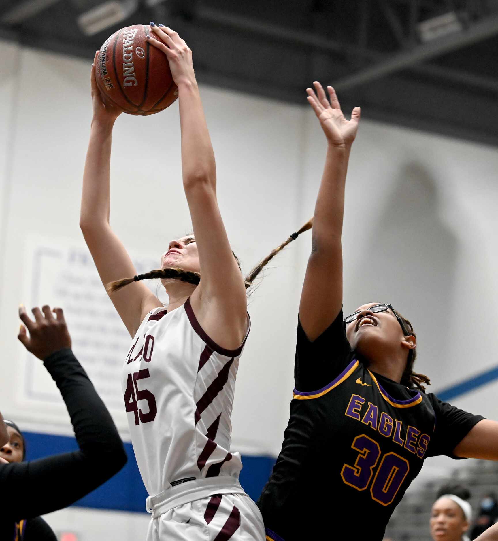 Plano’s Avery Foltz (45) grabs a rebound over Richardson’s Amya Patterson in the first half...