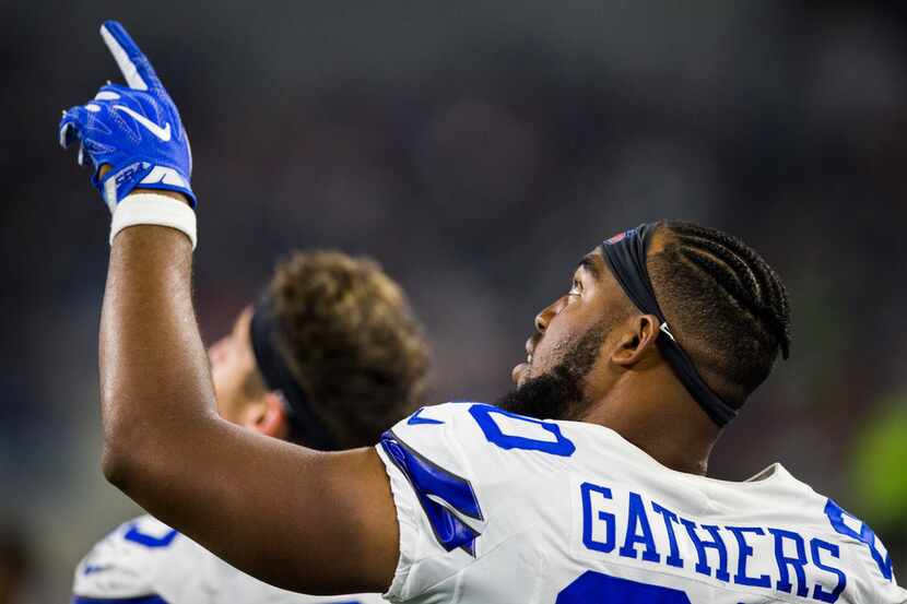 Dallas Cowboys tight end Rico Gathers (80) points to a replay on the big screen during the...