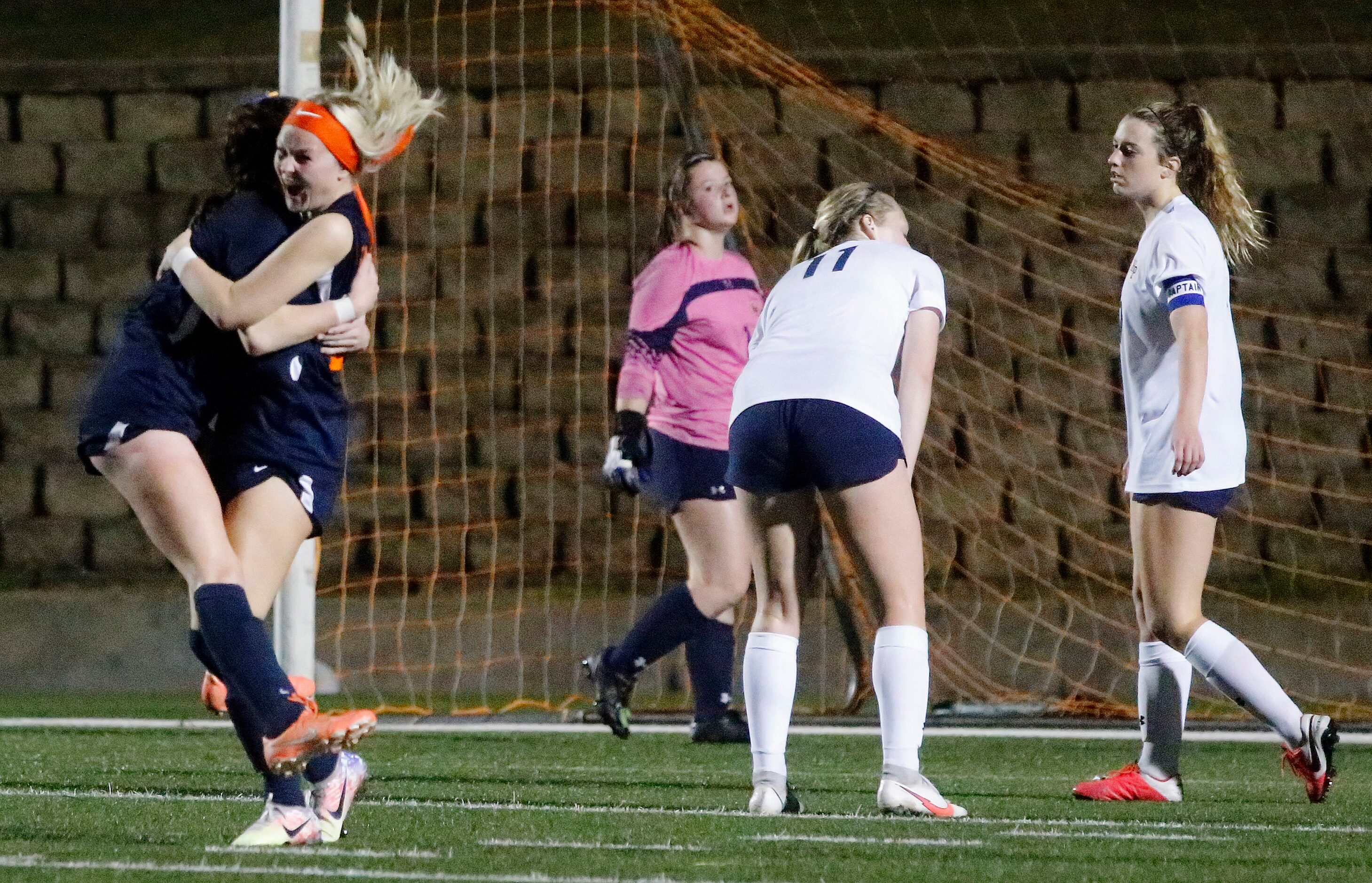 Wakeland midfielder Allie Perry (15) embraces midfielder McKenna Jenkins (22) after Jenkins...