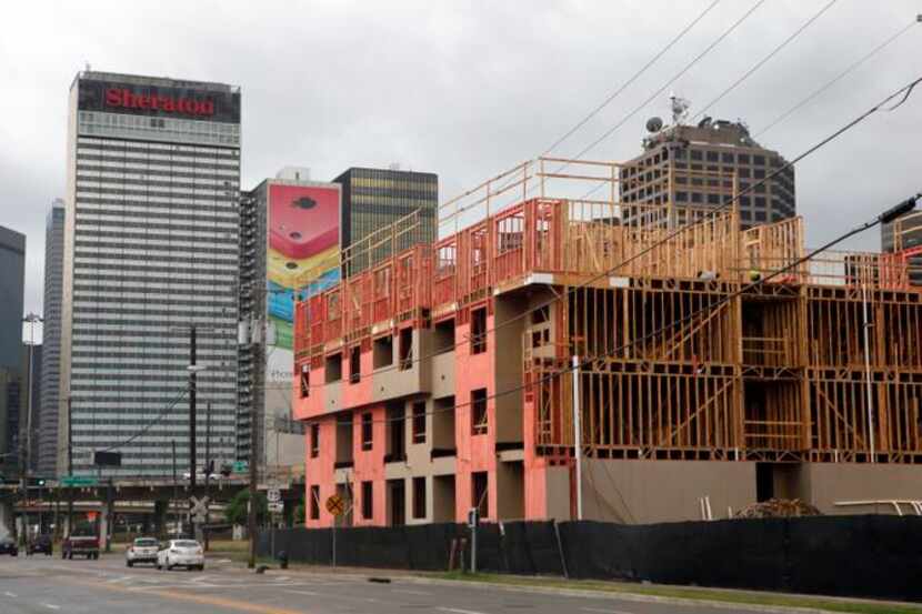 
Construction continued on the Elan City Lights apartments on Live Oak Street near downtown...