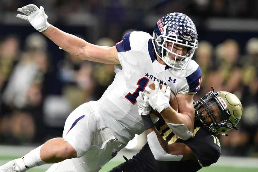 Denton Ryan-Birdville game.
Ryan wide receiver Drew Sanders (16) catches a pass, while being...