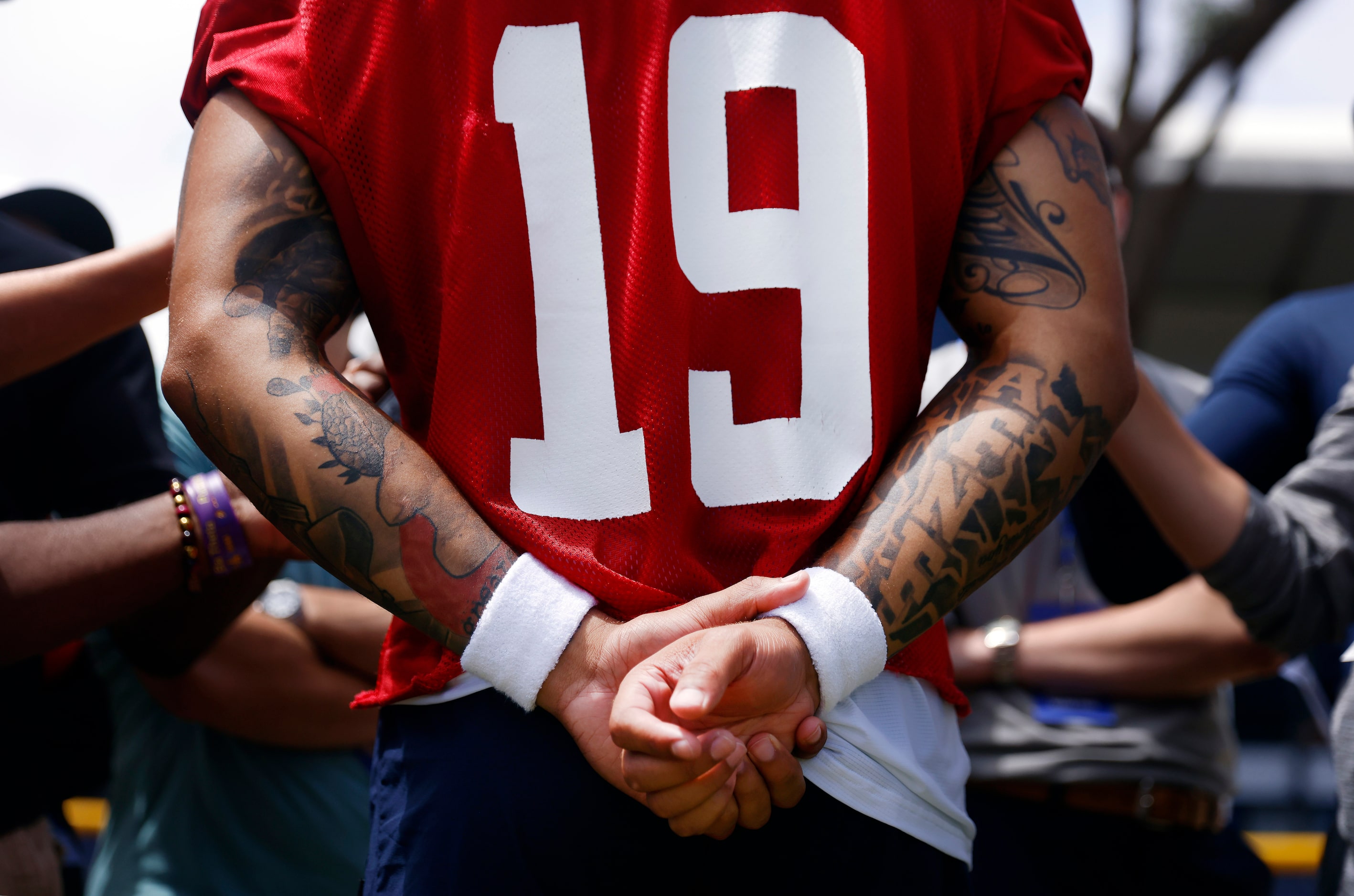 Dallas Cowboys quarterback Try Lance folds his hands as he answers questions from the media...