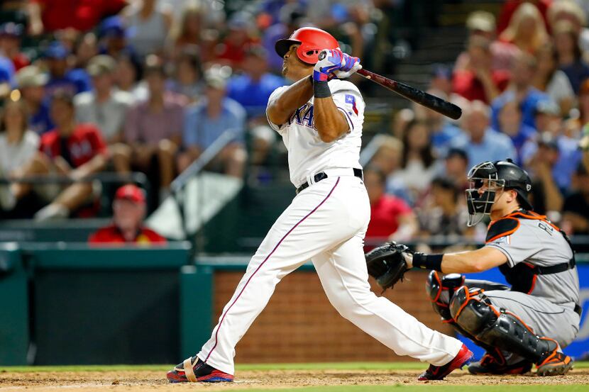 Rangers third baseman Adrian Beltre (29) strokes a double against the Miami Marlins in the...