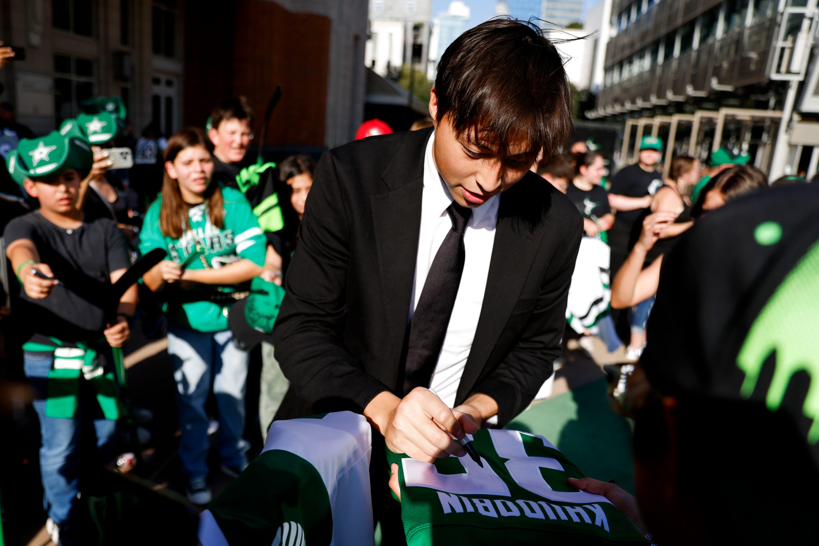 Dallas Stars left wing Jason Robertson gives autograph to the fans during the team’s home...