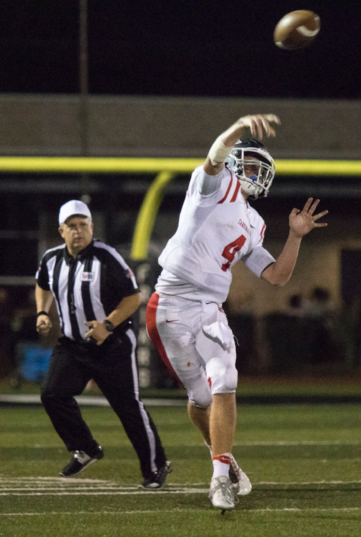 John Paul quarterback Andrew Barenberg (4) passes during Bishop Lynch's matchup against John...