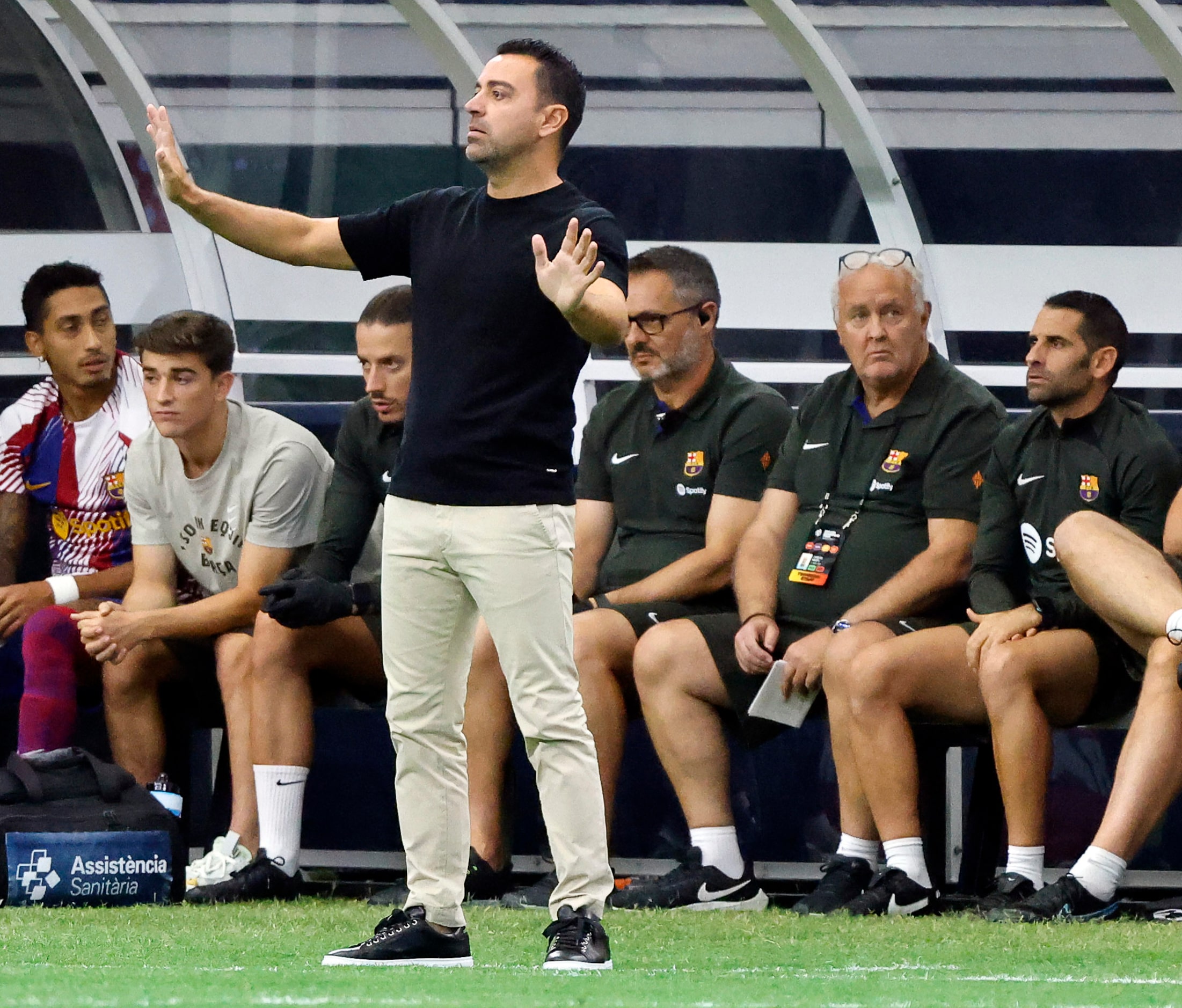 Barcelona head coach Xavier Hernandez signals to his players during the first half of their...