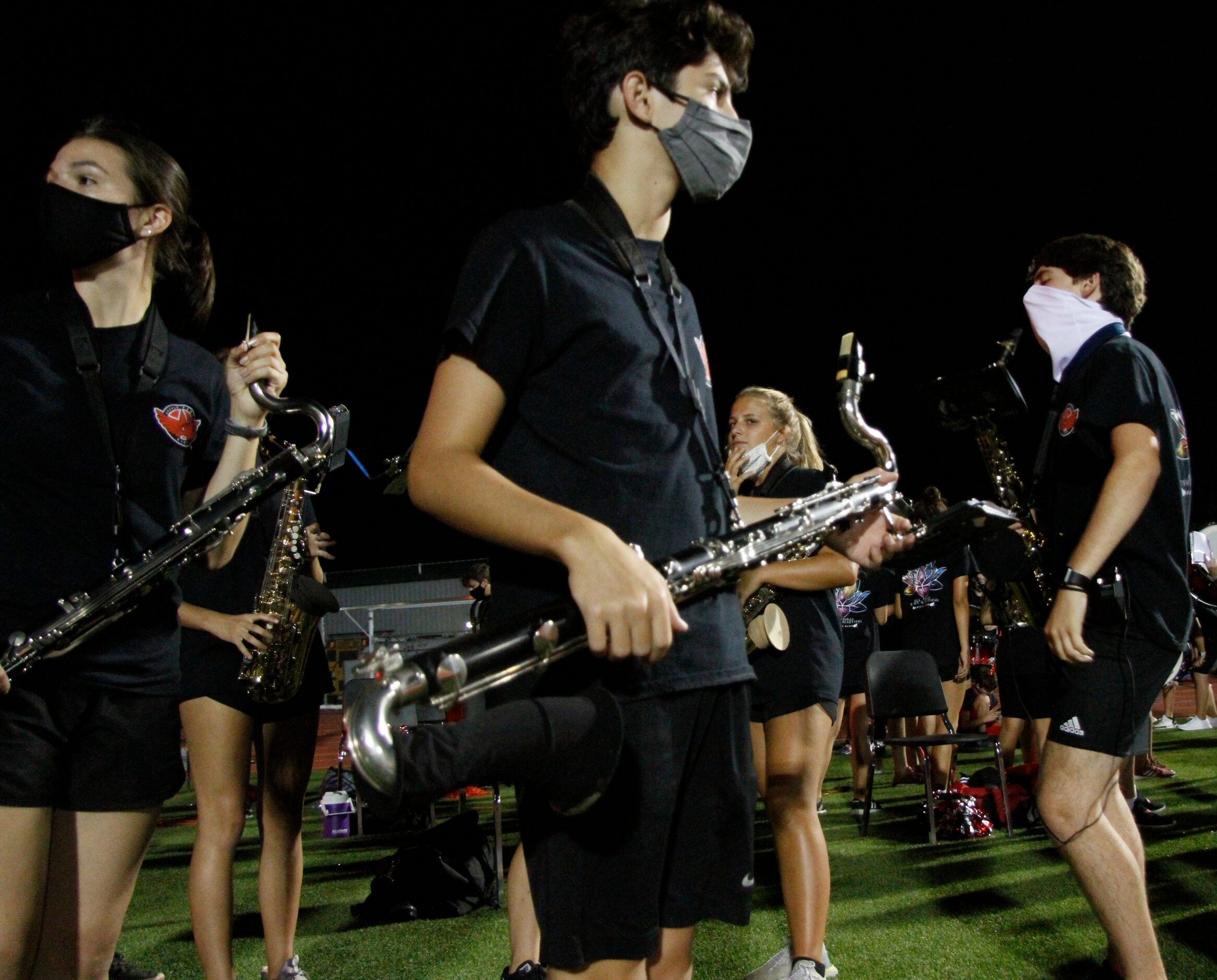 Members of the Argyle band assemble in the end zone in preparation of their field...