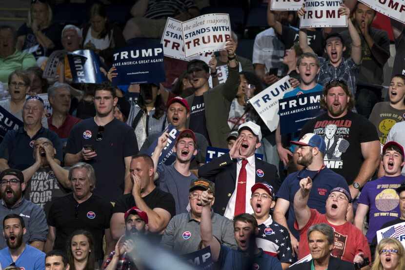 Supporters of Donald Trump cheer during a rally at the Richmond Coliseum in Richmond, Va.,...