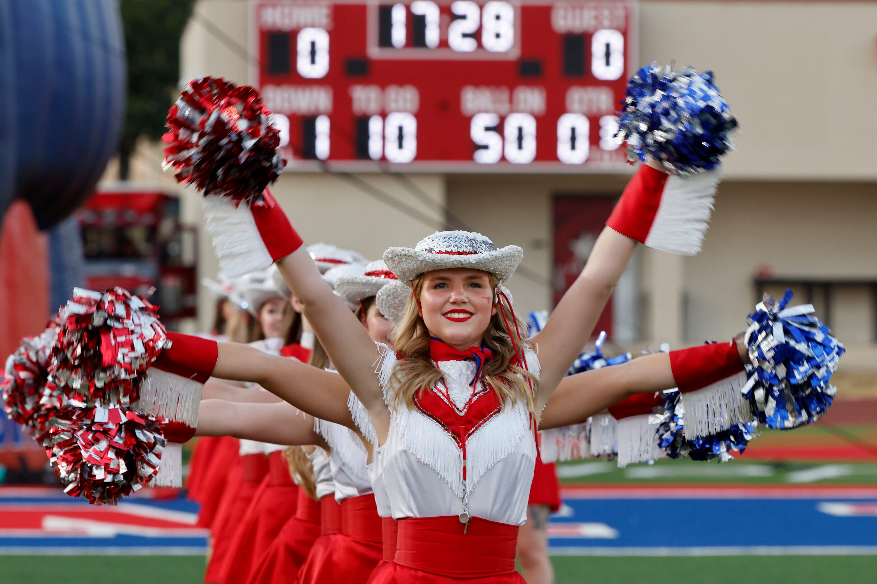 The Grapevine High School Fabulous Fillies prepare for a game against Frisco Wakeland during...