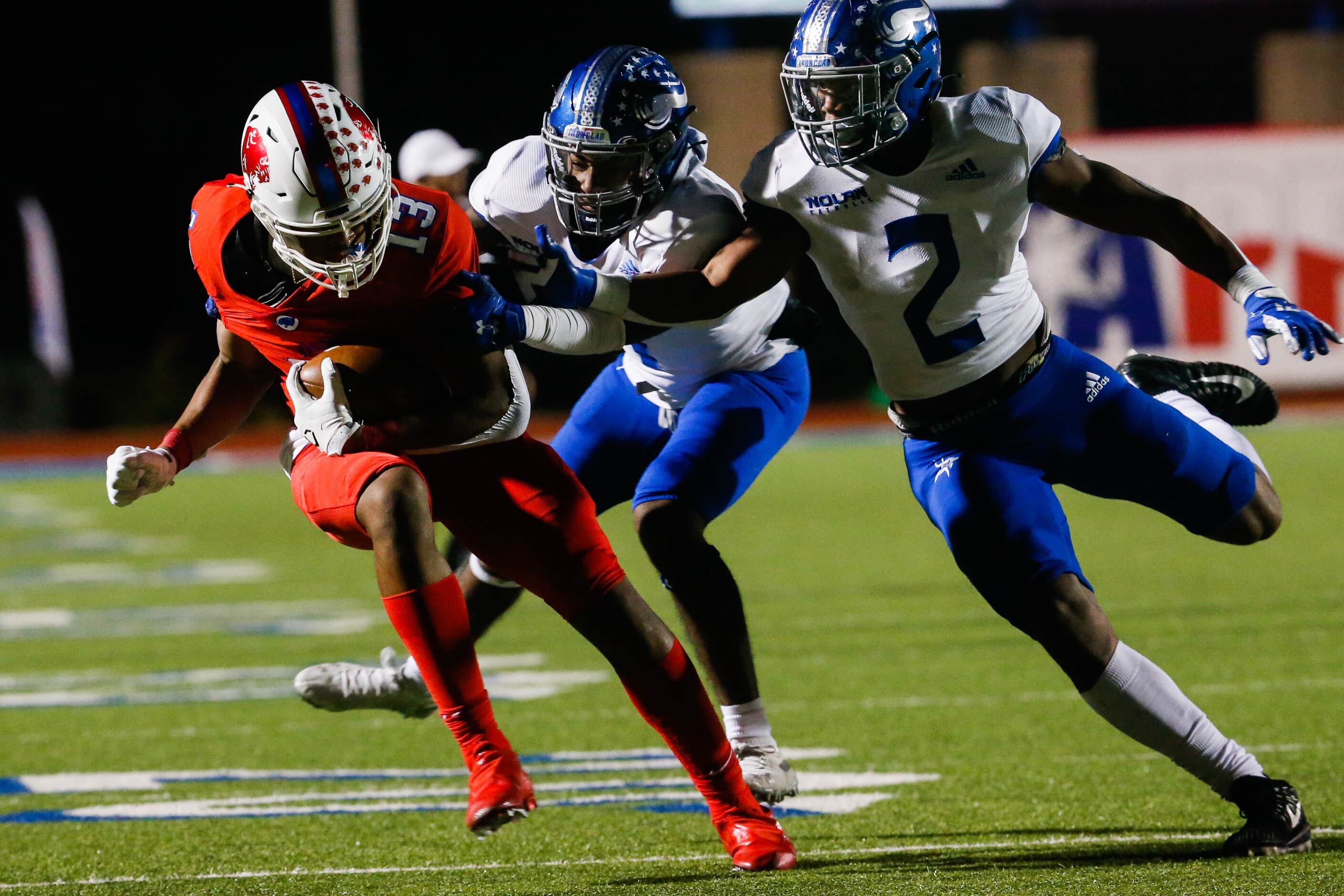 Parish Episcopal's Nathaniel Hill (13) evades the Fort Worth Nolan's defense during the...