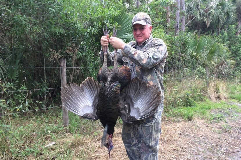 Paul Schmitz of Coral Springs, Fla. holds his first wild turkey gobbler, which had a 10-inch...