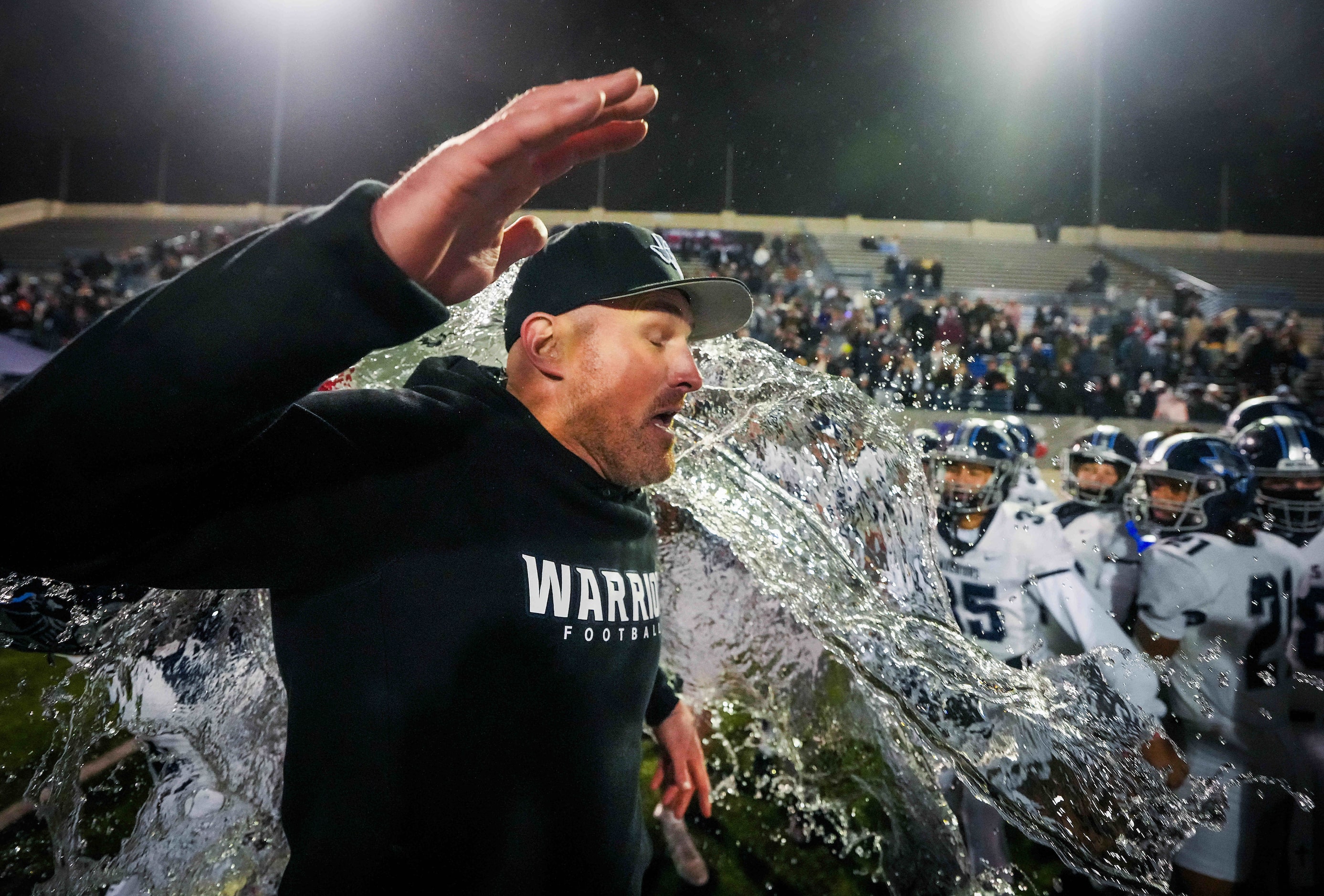 Argyle Liberty Christian head coach Jason Witten is doused by his players as they celebrate...