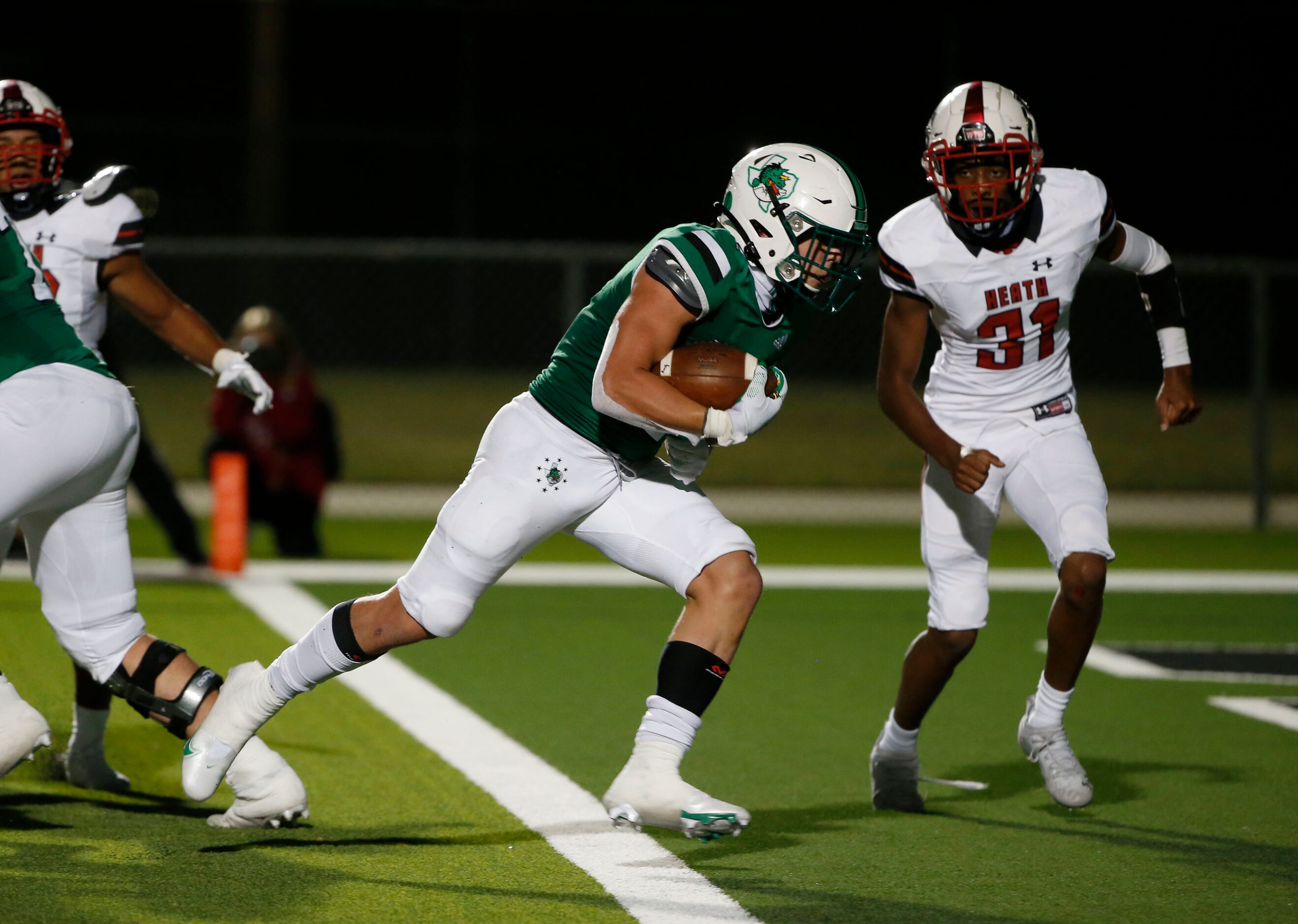 Southlake Carrolls’s Owen Allen (2) scores a rushing touchdown in front of Rockwall Heath’s...