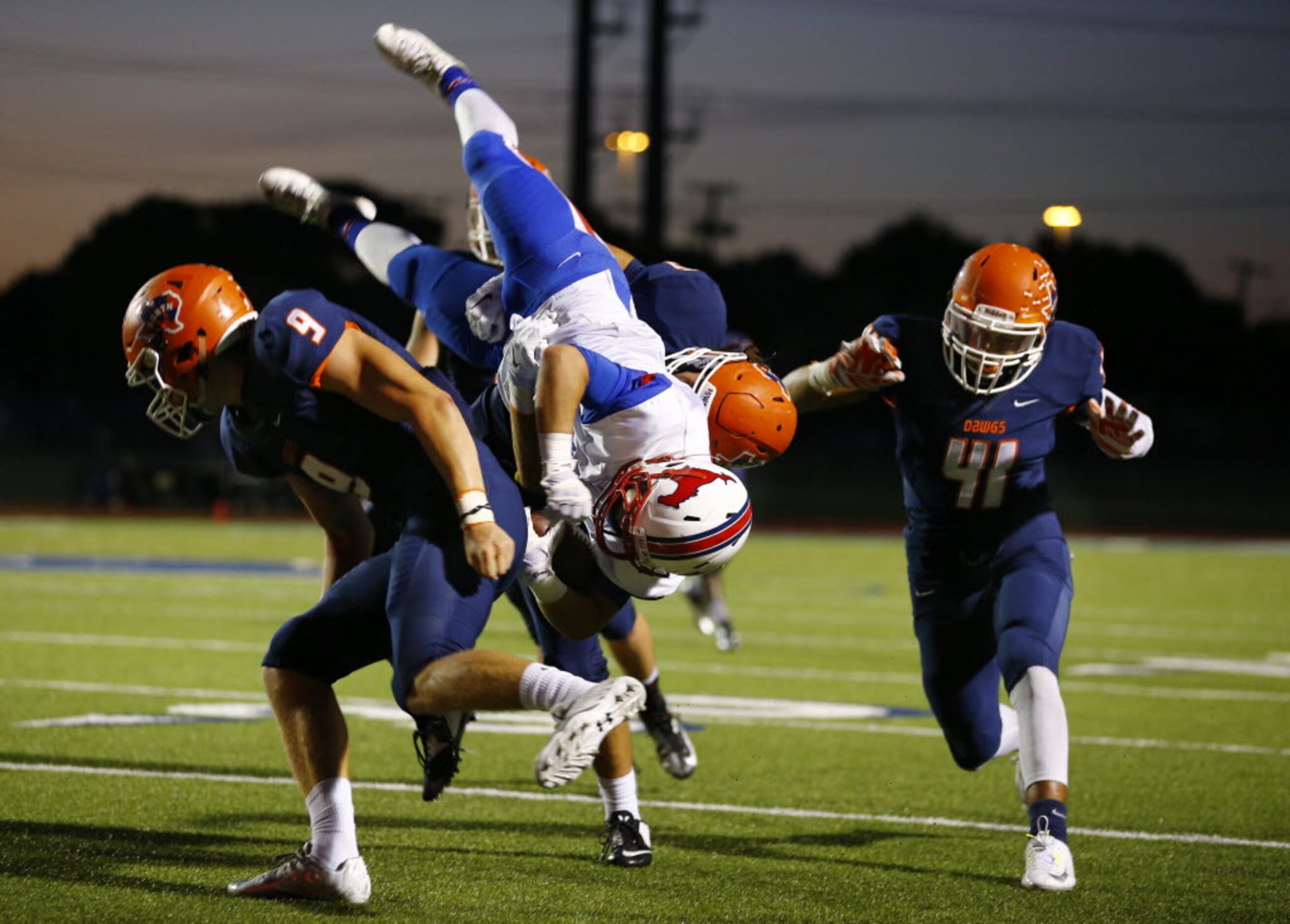 TXHSFB Richardson Pearce wide receiver Spencer Mandell (4) is tackled by McKinney North...