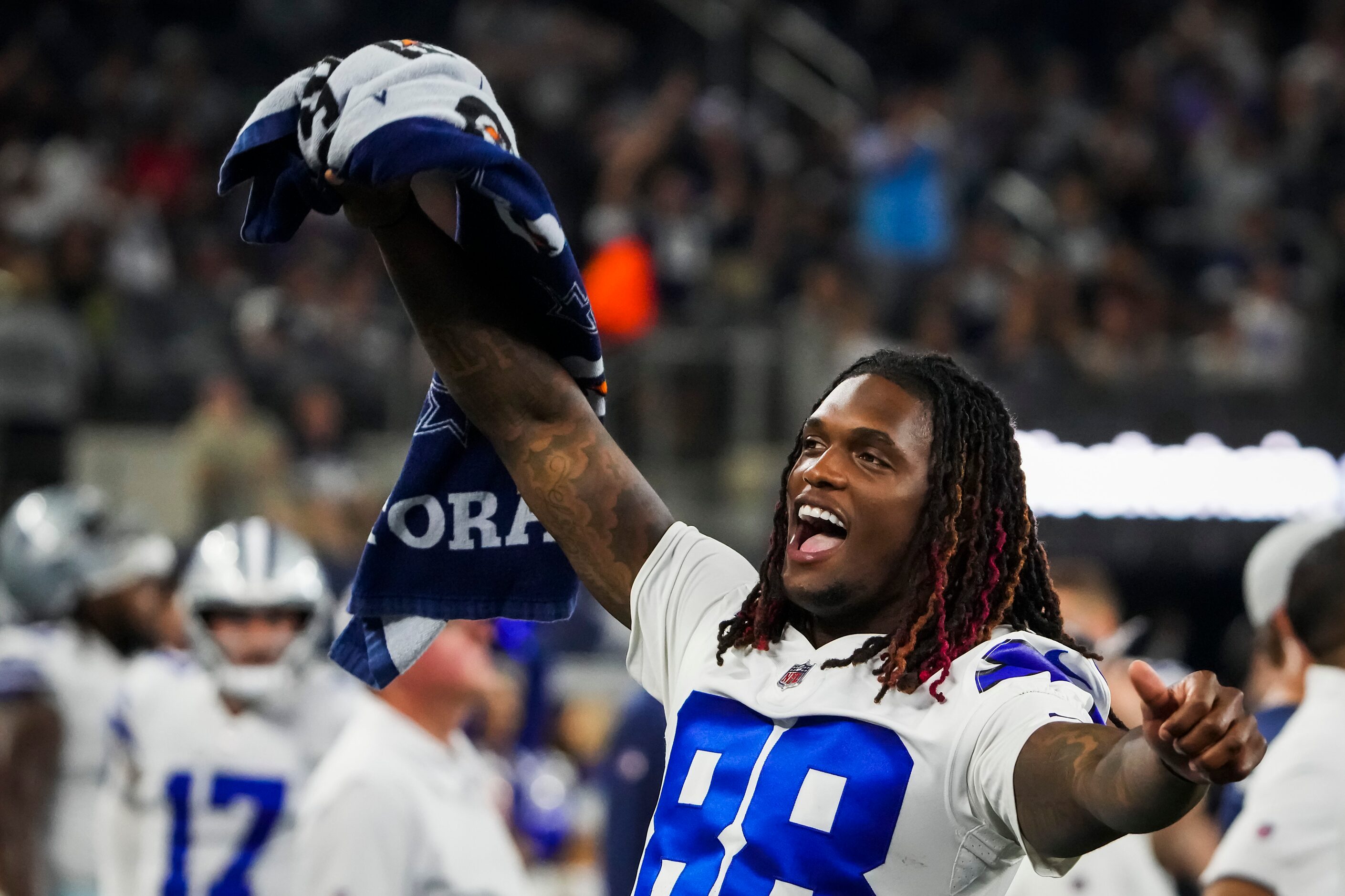 Dallas Cowboys wide receiver CeeDee Lamb (88) celebrates on the bench during the fourth...