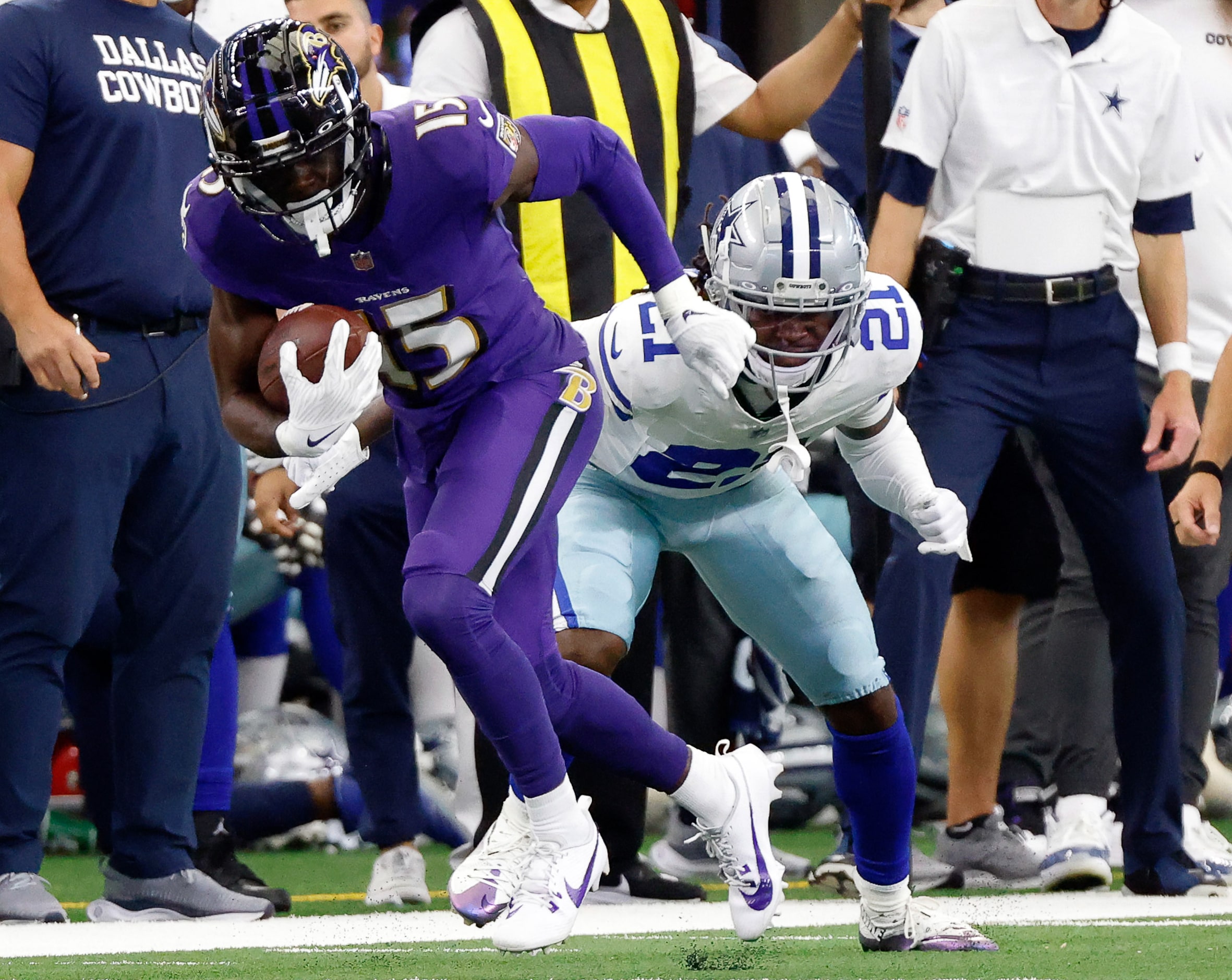 Baltimore Ravens wide receiver Nelson Agholor (15) dodged a tackle attempt by Dallas Cowboys...