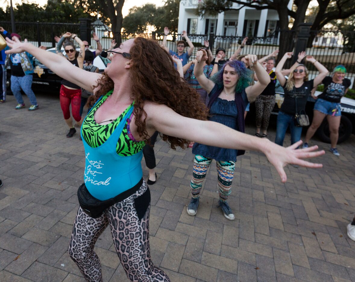 Fitness instructor Erica Nix leads some of the dancers that showed up to show their support...