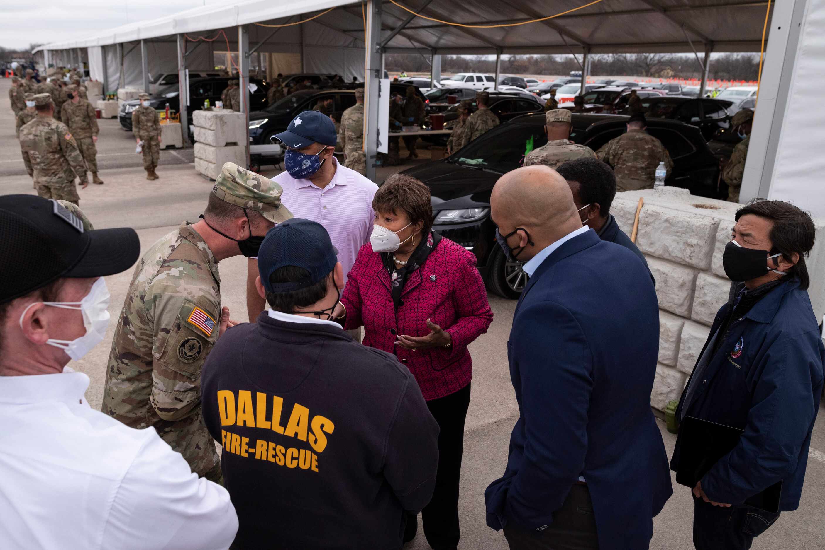 U.S. Representative Eddie Bernice Johnson (center) talks with Army Lt. Col. Nicholas Talbot...