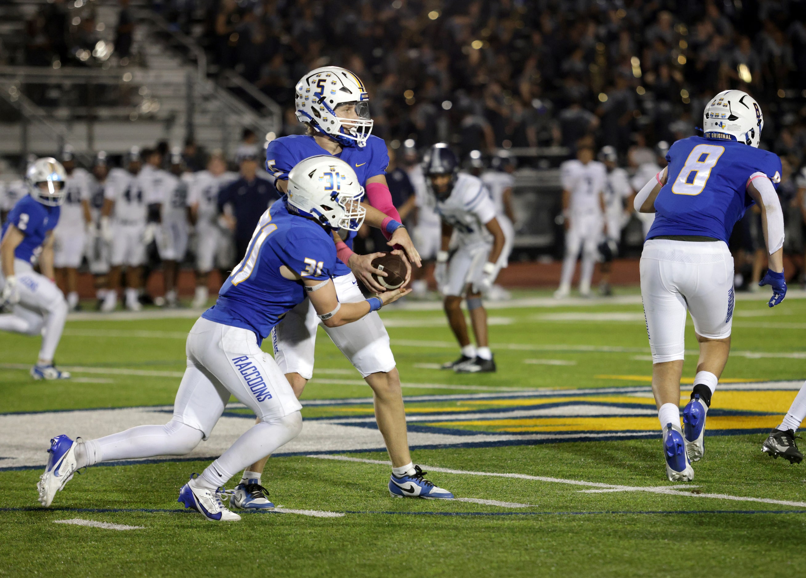 Frisco player #5 Cobyn Harbert fakes a handoff to player #31 Jacob Anderson during the...