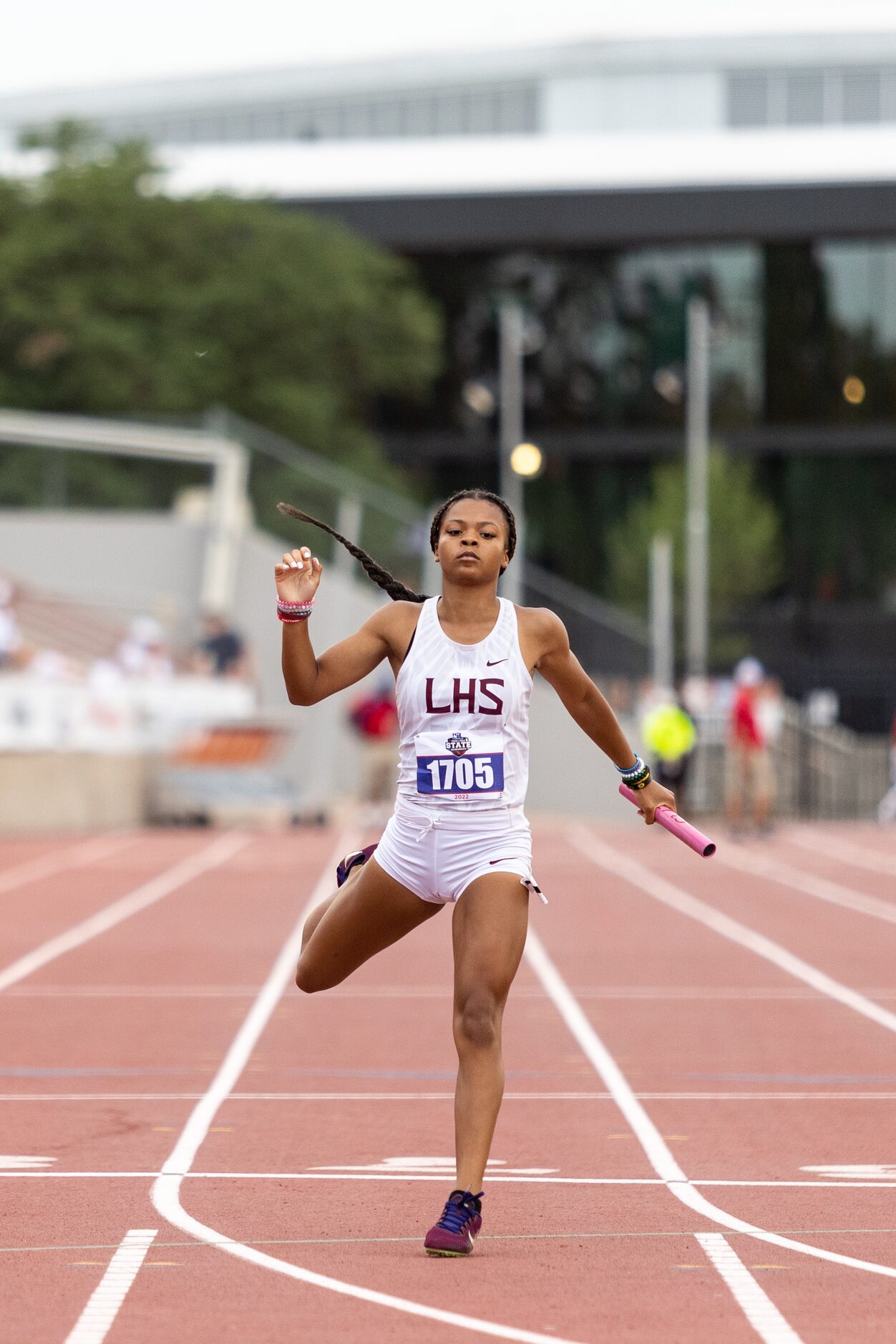 Te’Anna Harlin of Lewisville crosses the finish line during the girls’ 4x200-meter relay at...