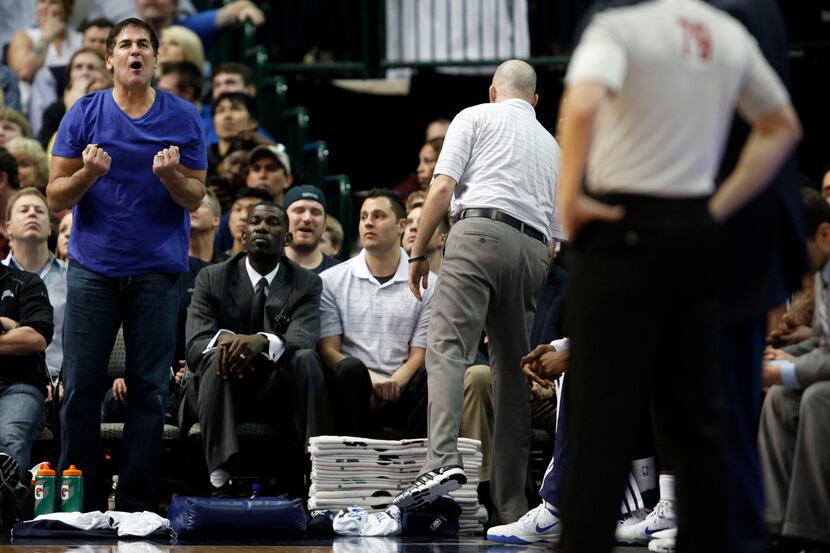 Dallas Mavericks owner Mark Cuban questions a call from referee Kevin Scott (79) during the...