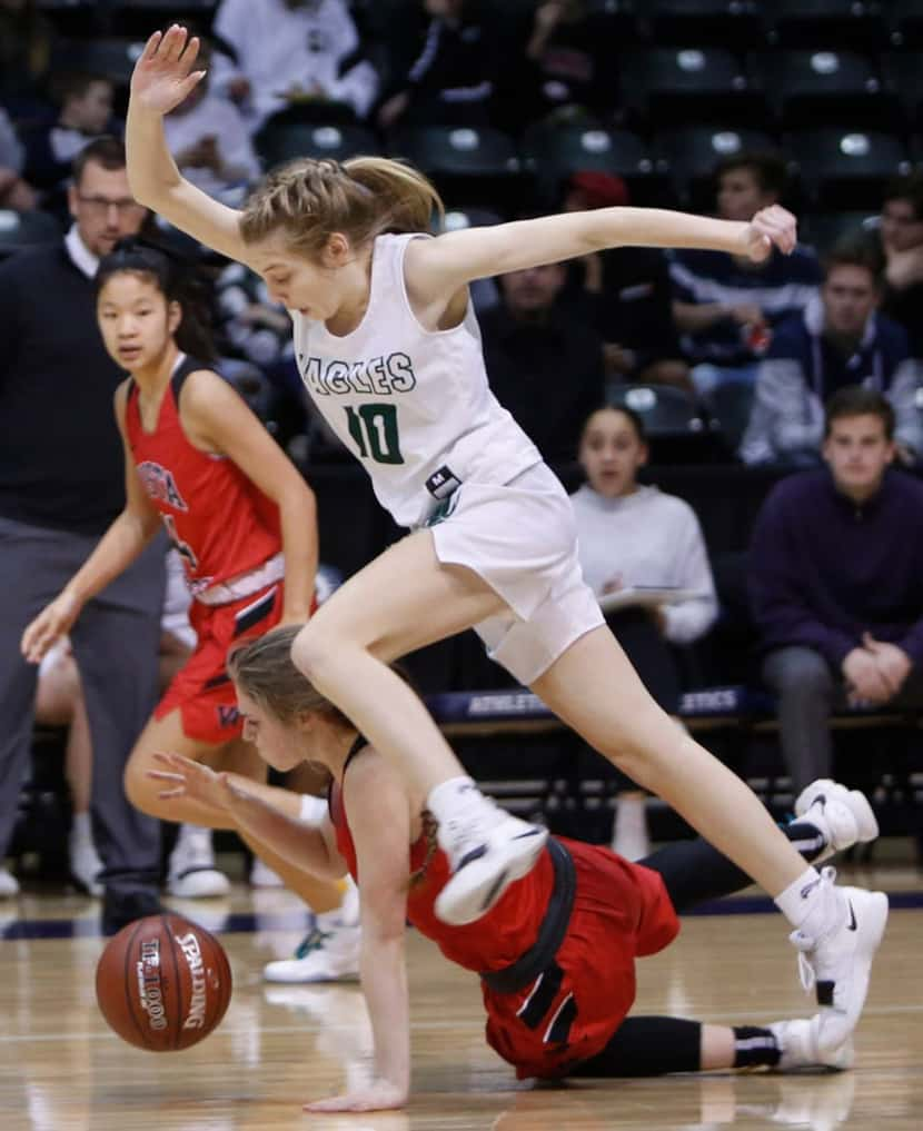 Prosper guard Hadley Murrell (10) takes the high road as Vista Ridge guard Kayli O'Riley...