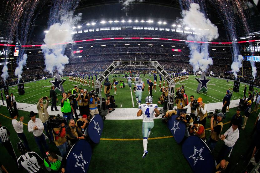 Dallas Cowboys quarterback Dak Prescott (4) runs onto the field during player introductions...