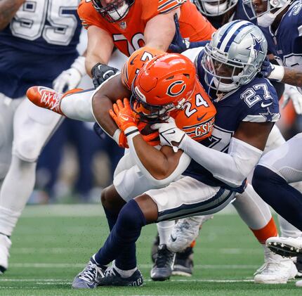Dallas Cowboys safety Jayron Kearse (27) tackles Chicago Bears running back Khalil Herbert...