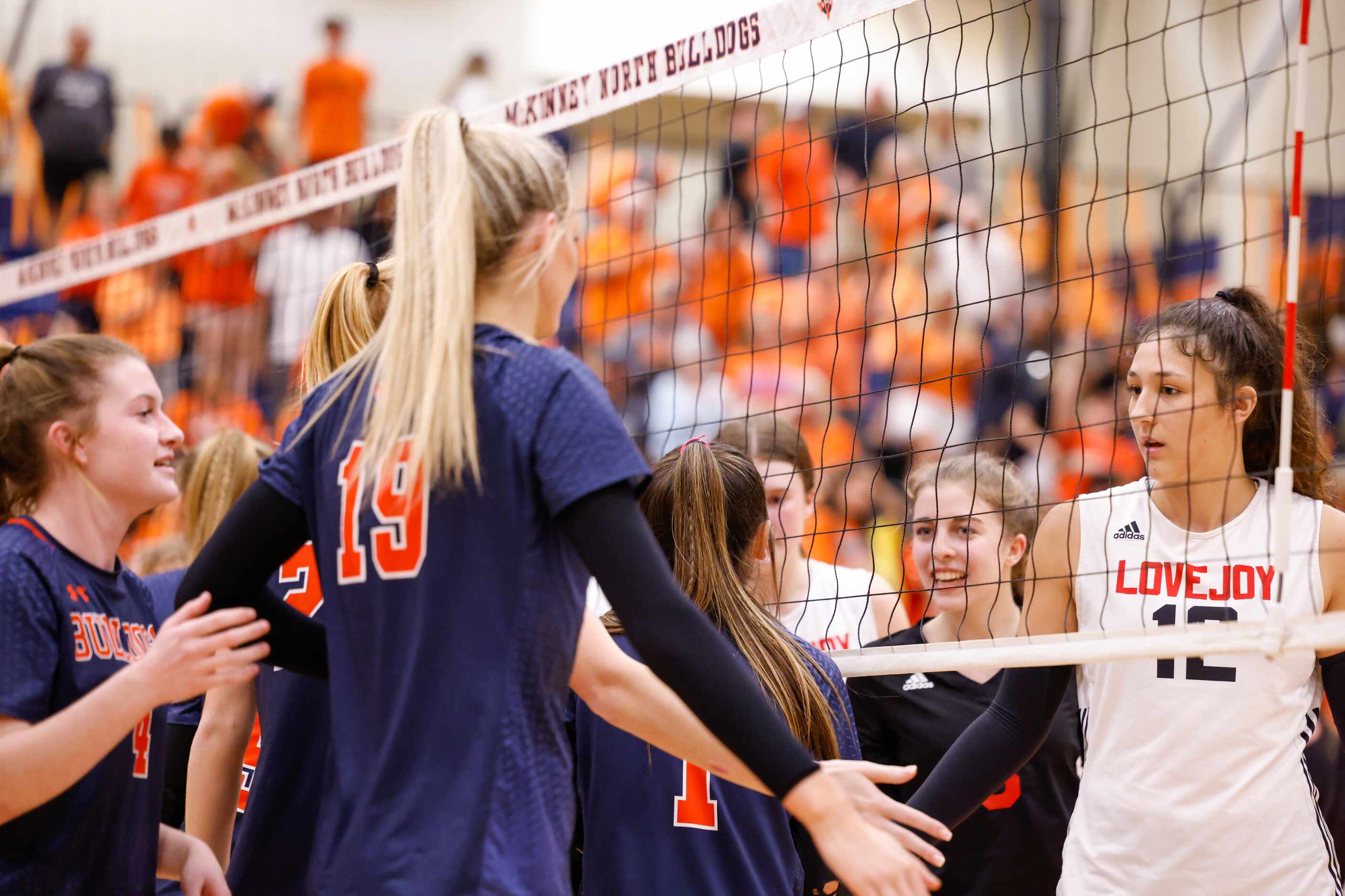 Lovejoy Hannah Gonzalez (12) claps hands with McKinney North players after a match in...