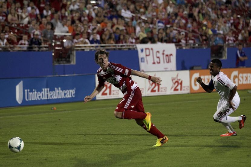 Zach Loyd, #17, looks to pass and is chased by Joao Plata, #8,during the FC Dallas vs. Real...