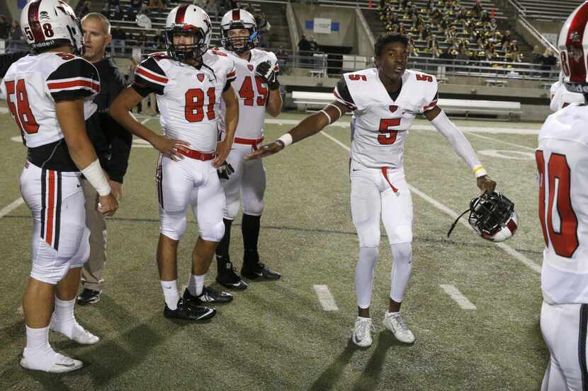 Flower Mound Marcus's Matt Hankins (5) dances during warmups against Mansfield at Birdville...