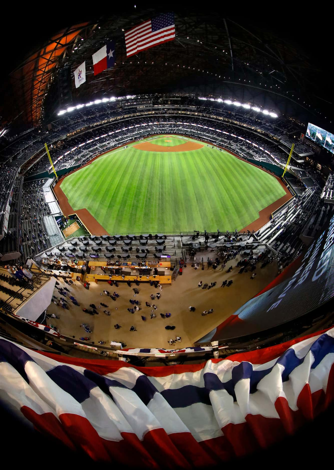 Los Angeles Dodgers and Tampa Bay Rays fans listen to national anthem as it's played before...