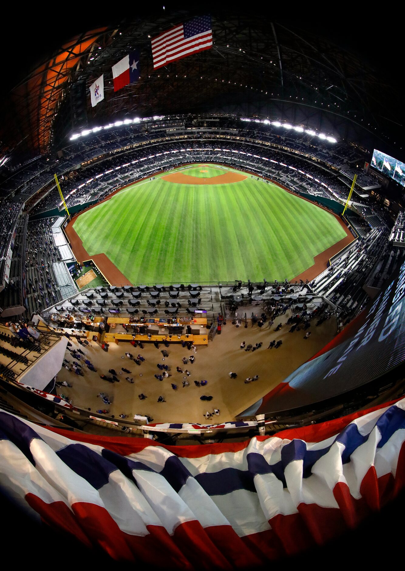 Los Angeles Dodgers and Tampa Bay Rays fans listen to national anthem as it's played before...