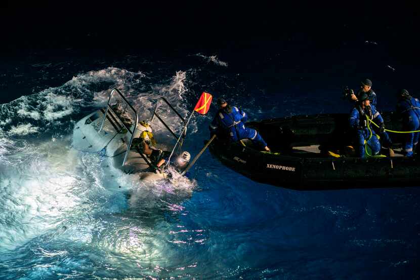 The Limiting Factor being recovered after its first dive to the deepest point of the...