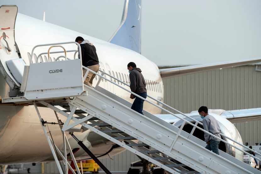 FILE - Guatemalan migrants board a deportation flight under Title 42 authority in Harlingen,...