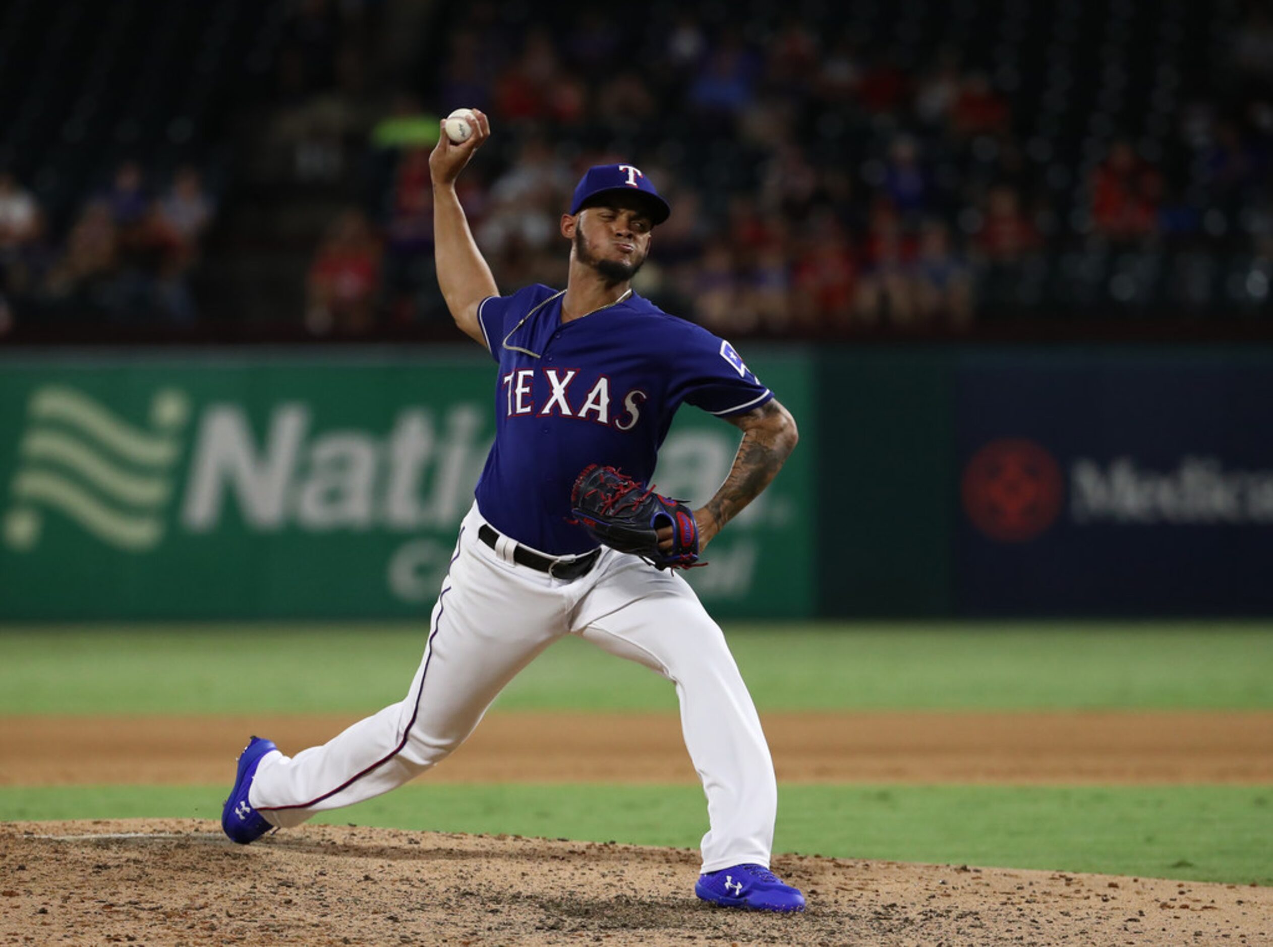 ARLINGTON, TEXAS - AUGUST 21:  Jonathan Hernandez #72 of the Texas Rangers throws against...