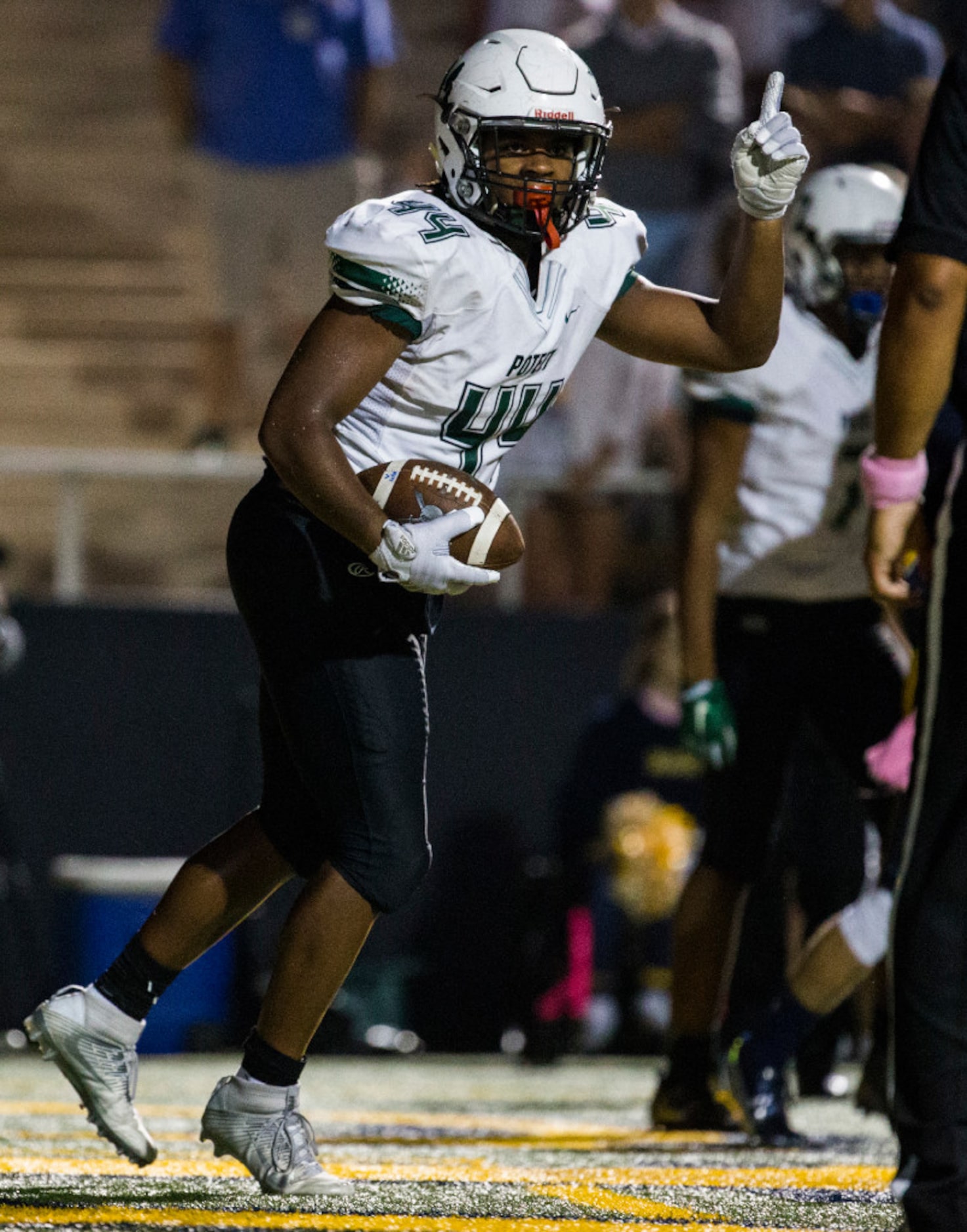 Mesquite Poteet linebacker Noah Ingram (44) celebrates after scoring a two point conversion...