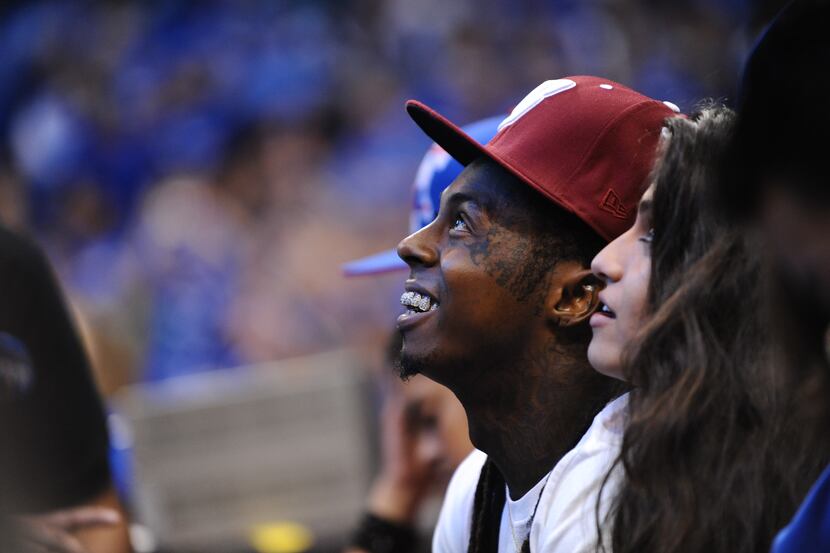 Rapper Lil Wayne cheers in the game of the Dallas Mavericks against the Miami Heat in Game...