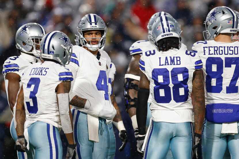 Dallas Cowboys quarterback Dak Prescott (4) talks with wide receiver Brandin Cooks (3)...