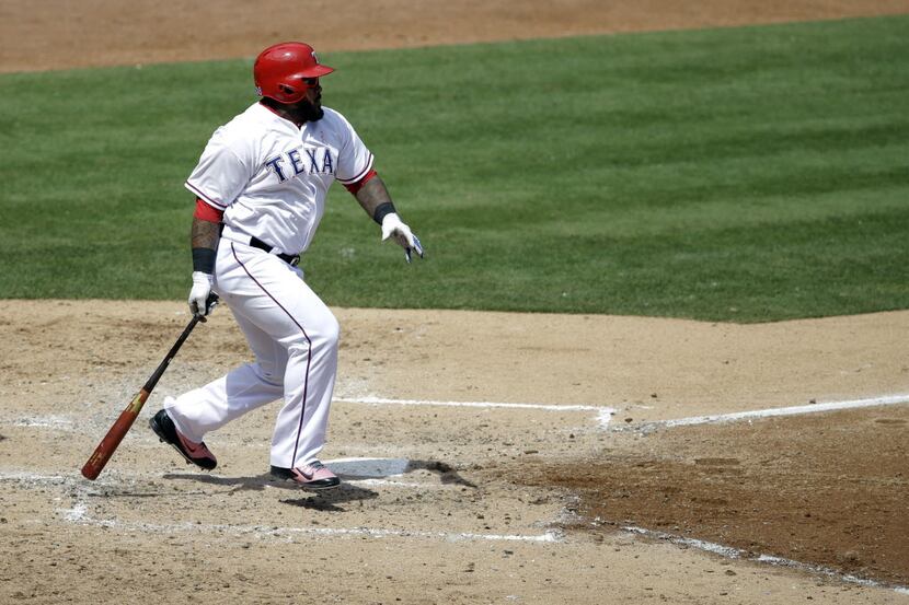 Texas Rangers' Prince Fielder singles to center against the Boston Red Sox in the fourth...