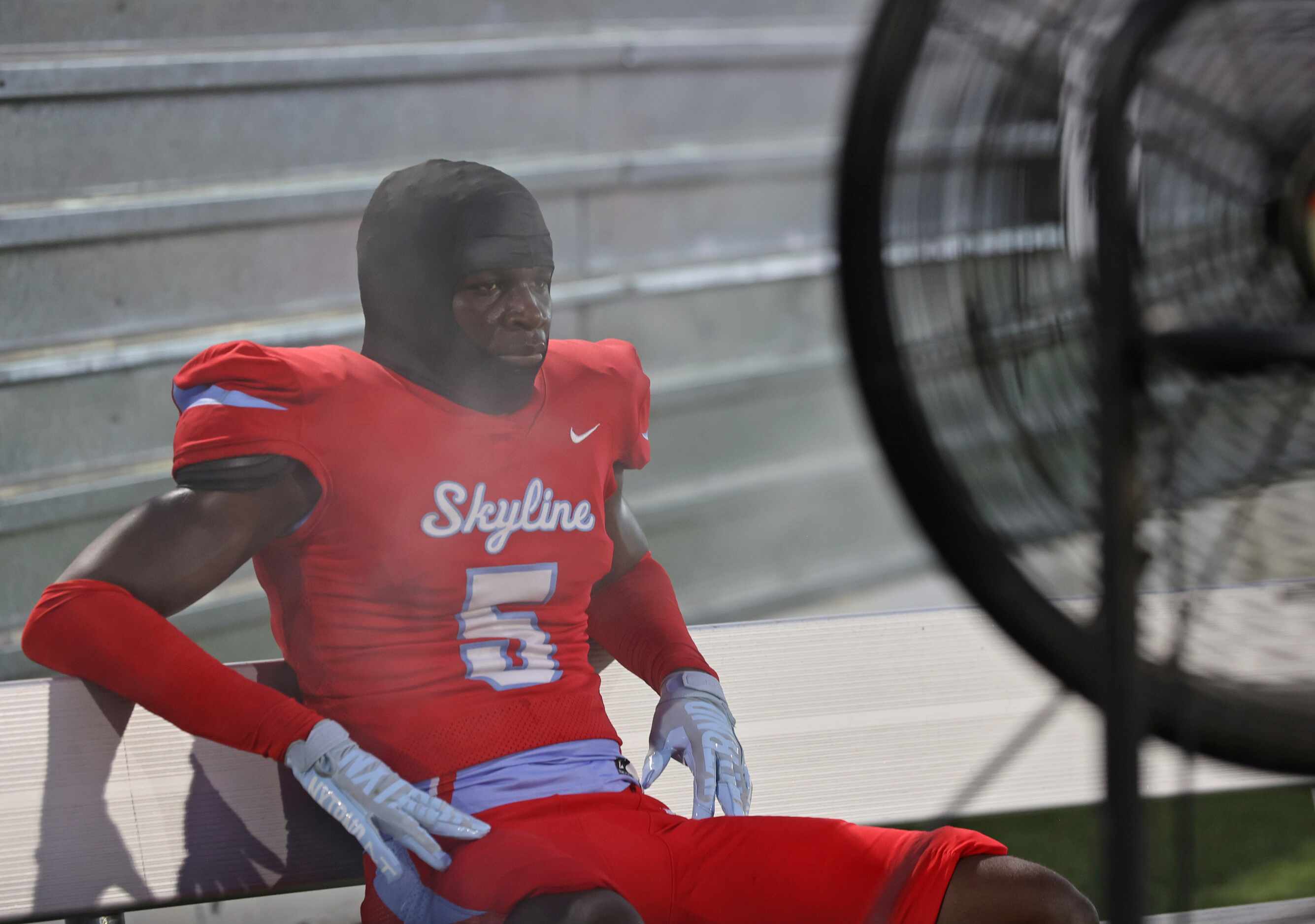 Skyline’s Jacorey York (5) sits in front of a mister fan during the first half of a high...