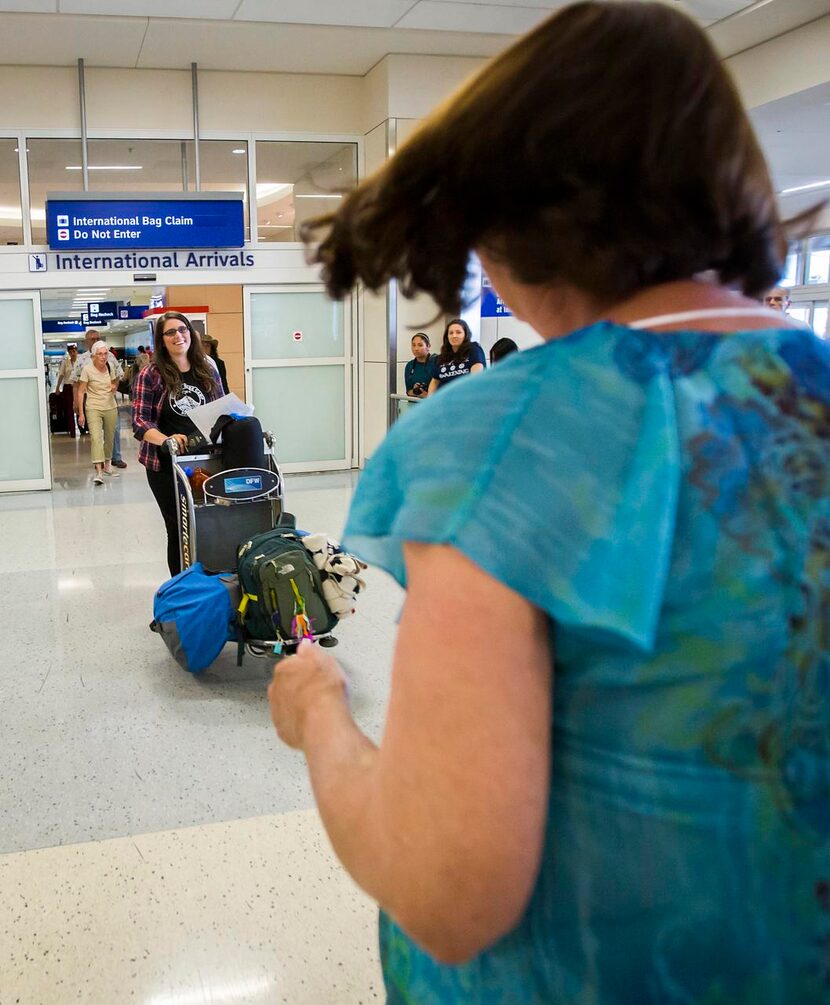 
Sharon Banks (right) runs to greet her daughter Danielle as she arrives at DFW Airport.
