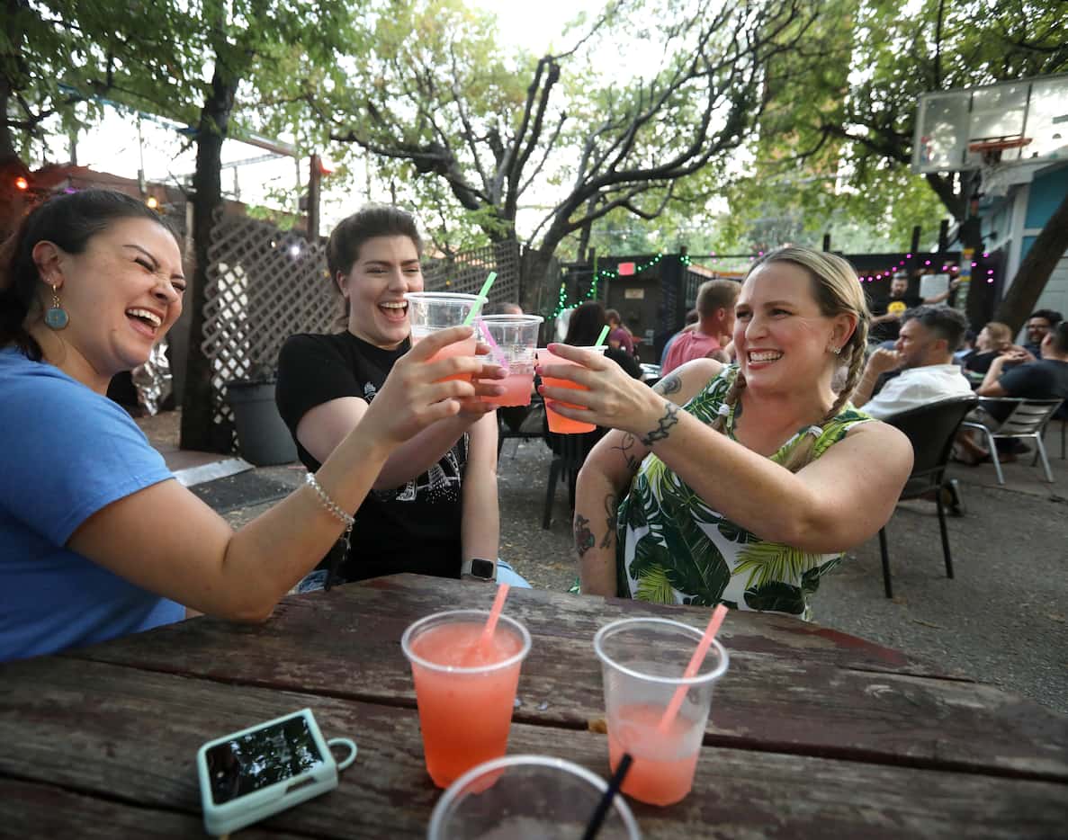 Crystal Cook, left, Courtney Snelson, and Holly Brown enjoy one last evening at the...