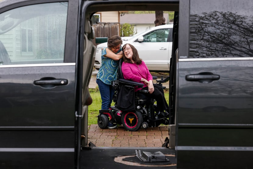 Laurie Truesdell, 49, of Mesquite, and her community care attendant Leah Gardner (left),...