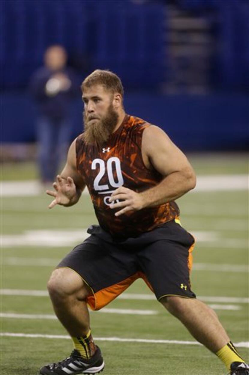 Wisconsin offensive lineman Travis Frederick runs a drill during the NFL football scouting...